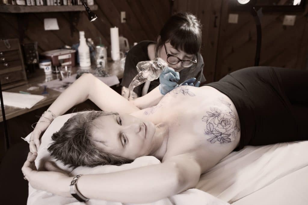 Cora getting tattoos